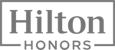 The image shows the Hilton Honors logo, featuring the word "Hilton" above "Honors" in stylized text within a rectangular frame.
