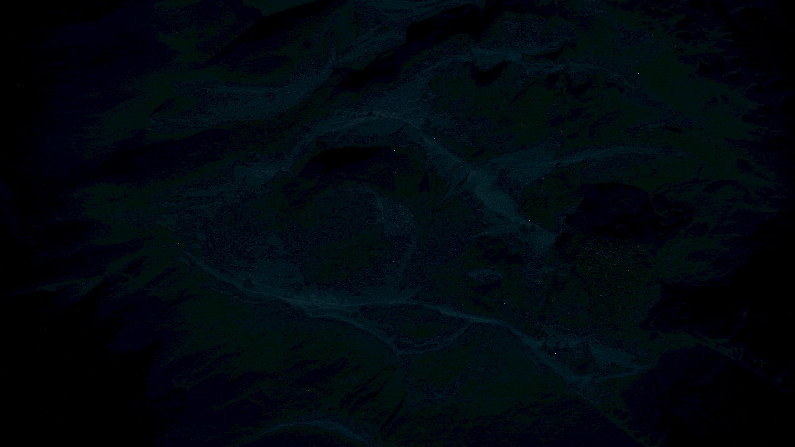 The image is too dark and unclear, so details are difficult to discern or describe accurately.
